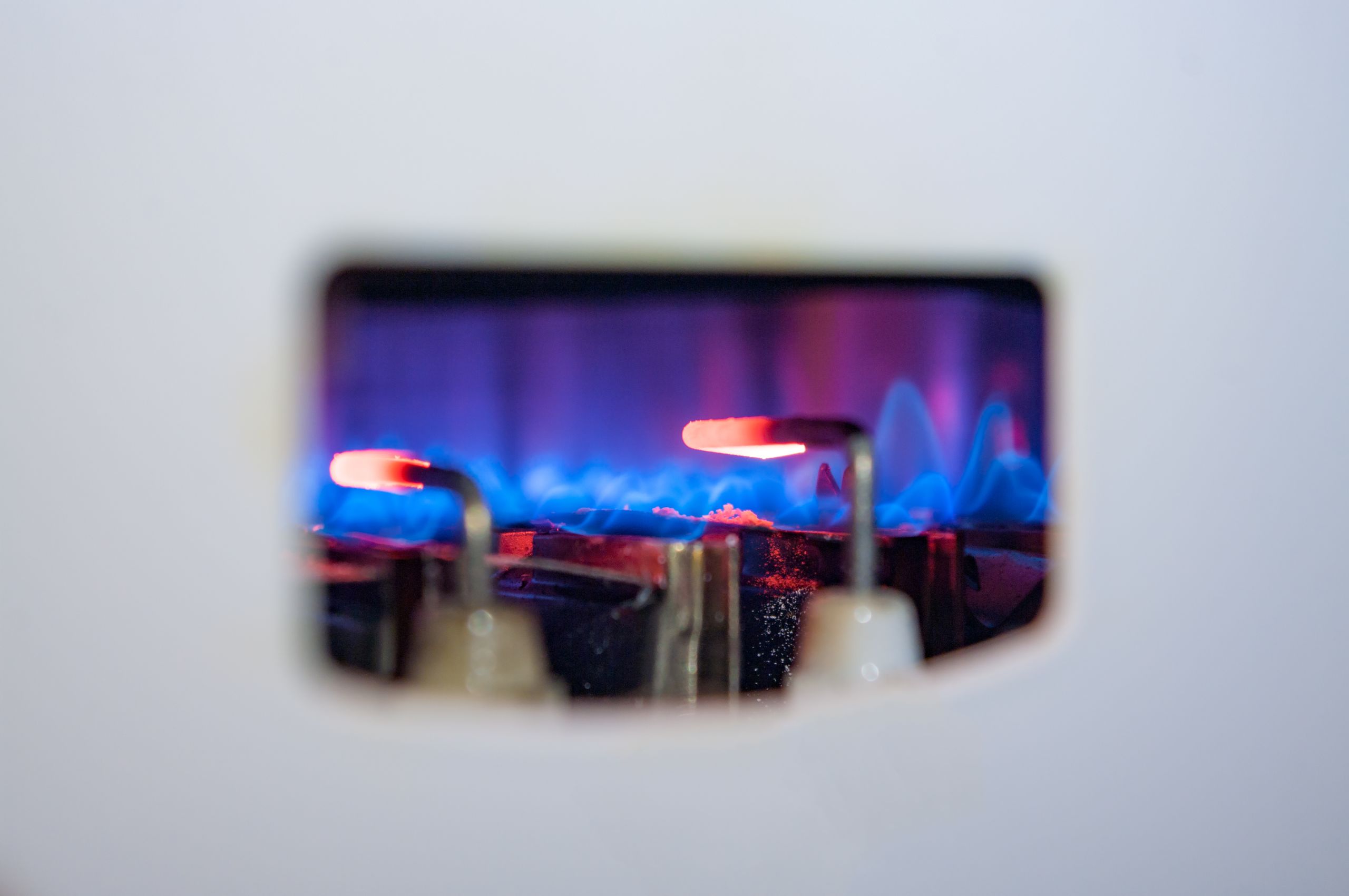 Gas stove with a blue flame.