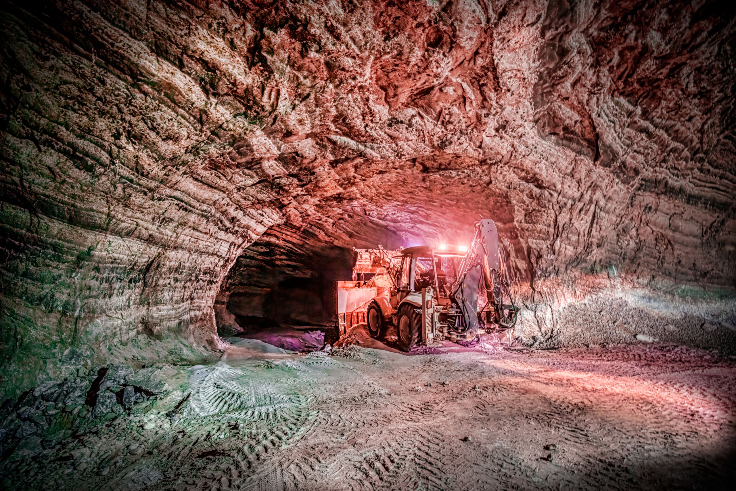 Image of a cave with a tractor in it