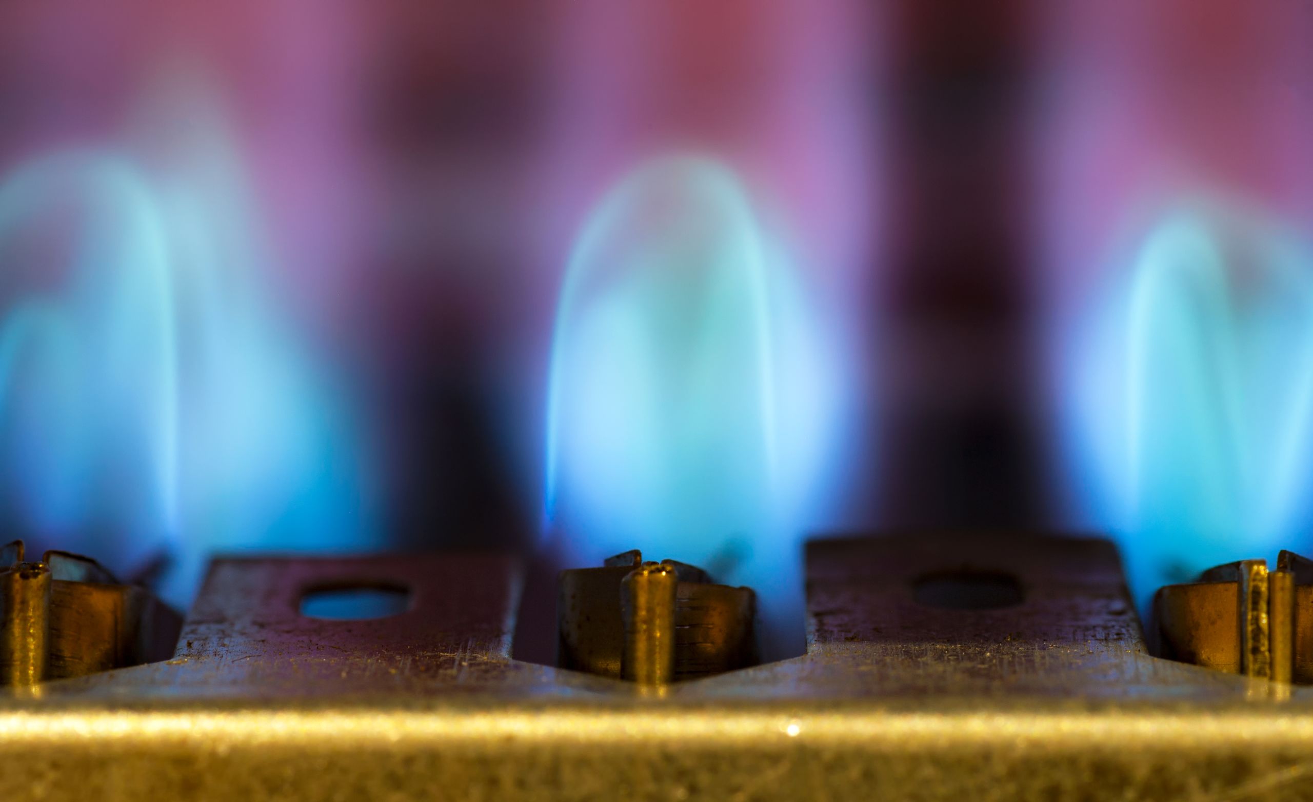 Gas stove with a blue flame.