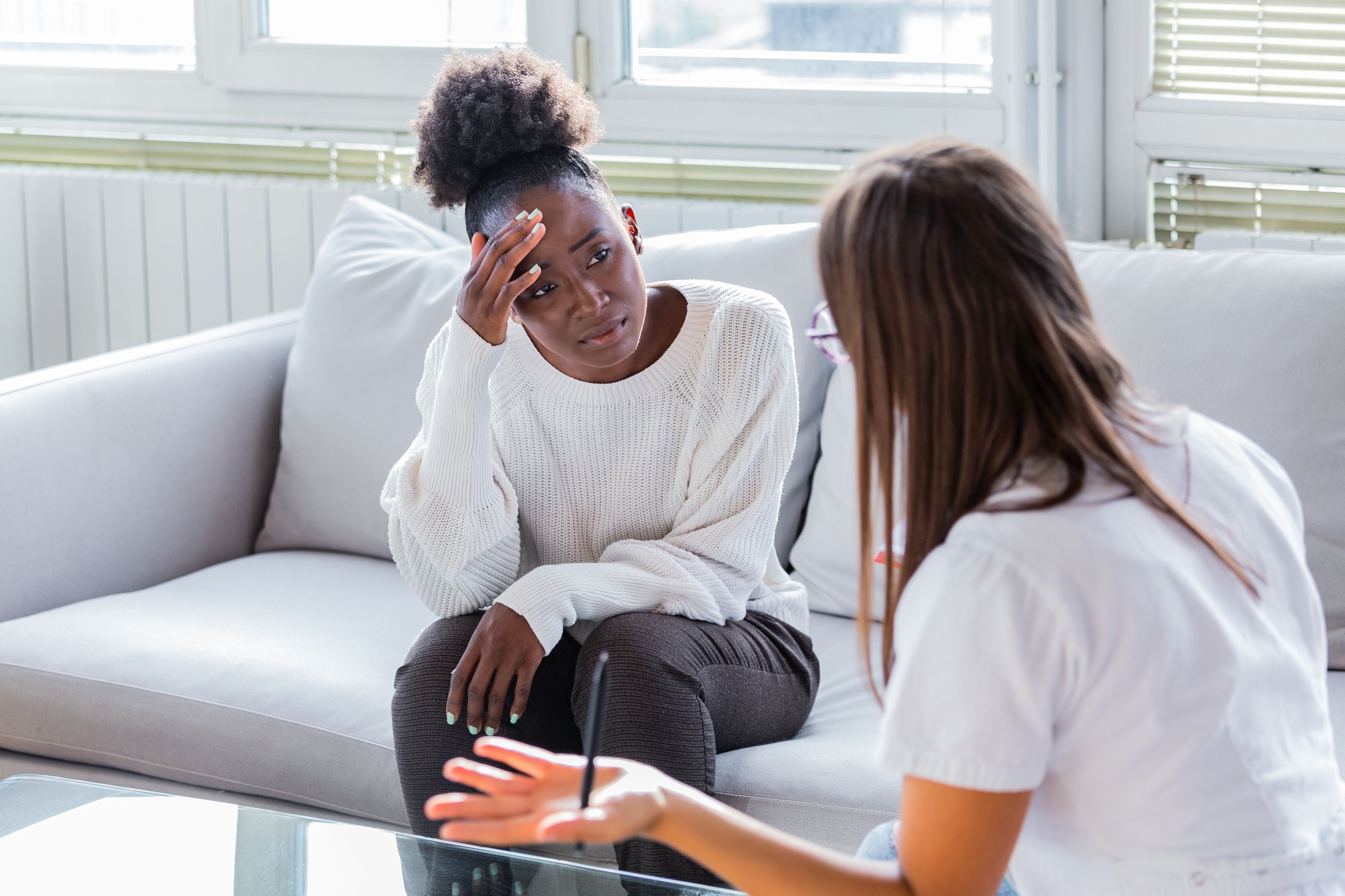 An upset woman in a therapy session