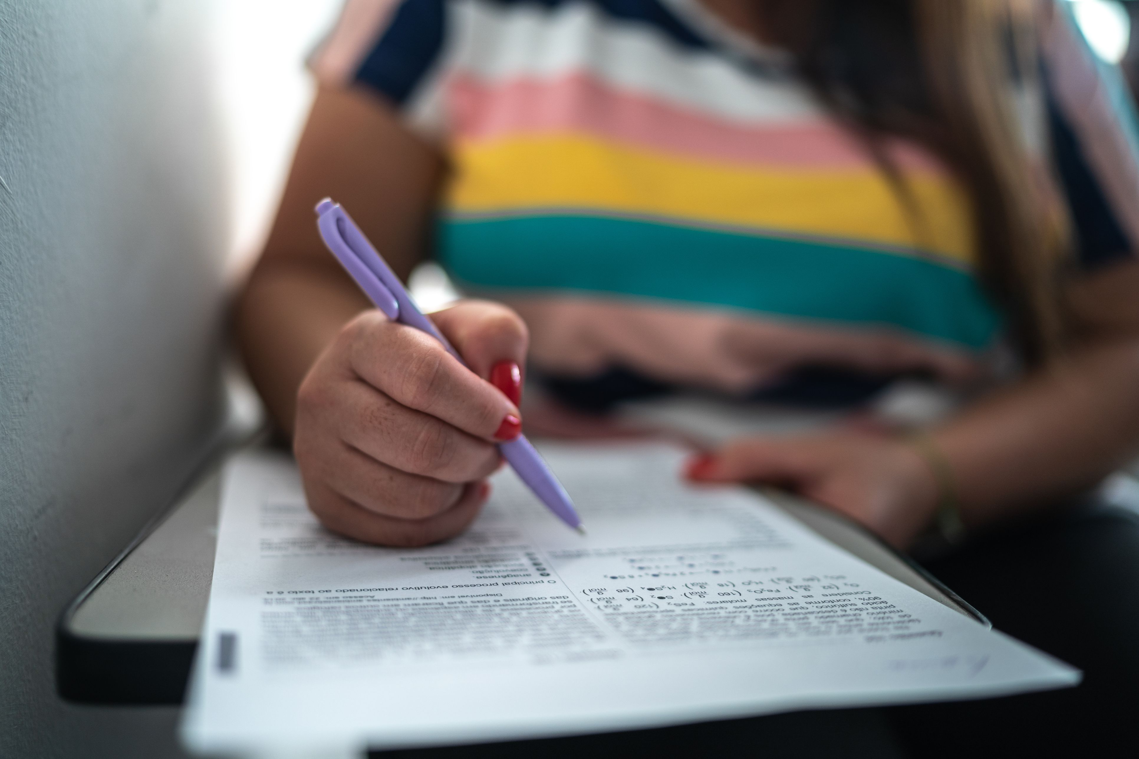 A person filling in a form