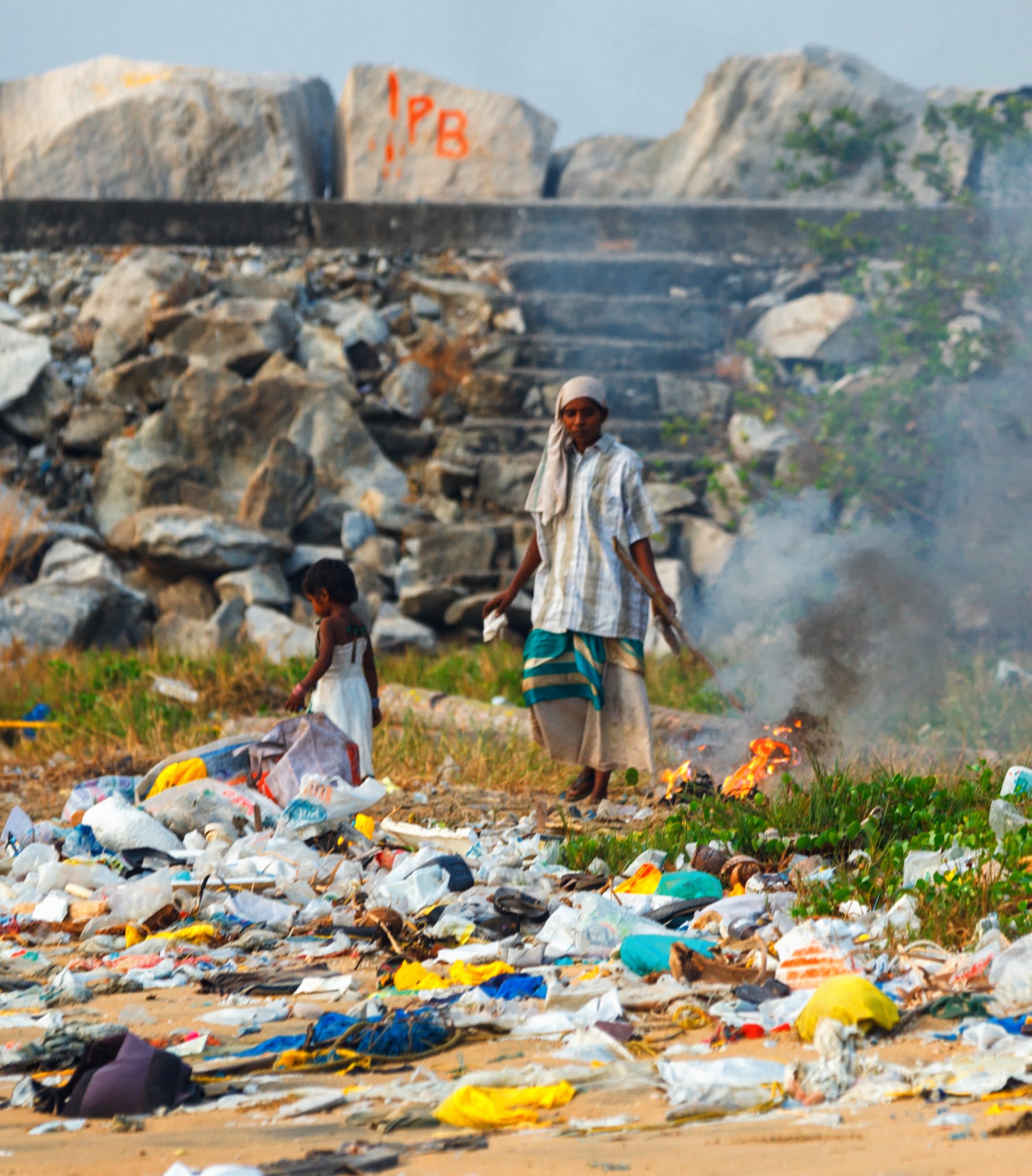 Asian man burning rubbish