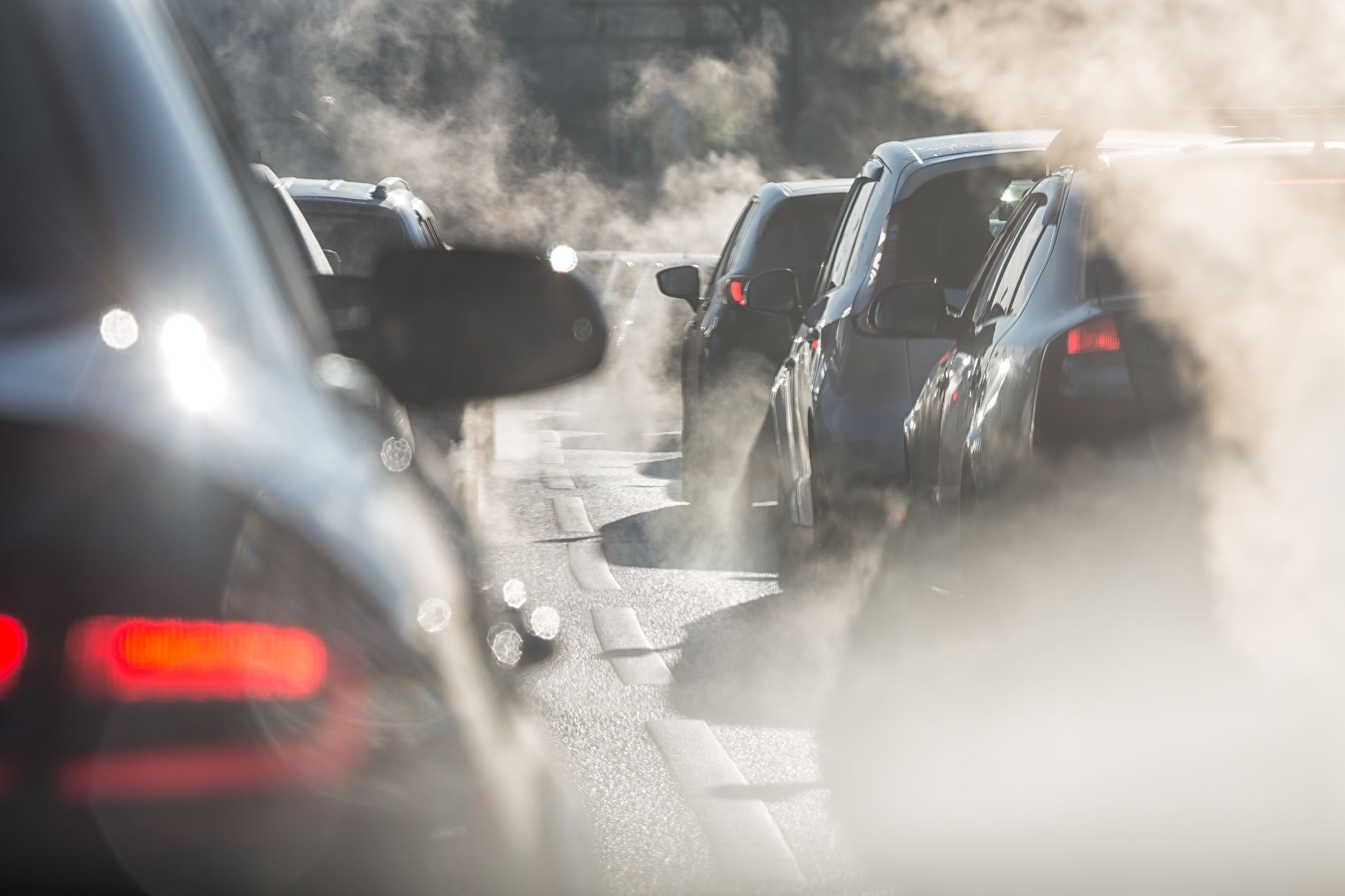 Exhaust fumes obscuring cars in traffic