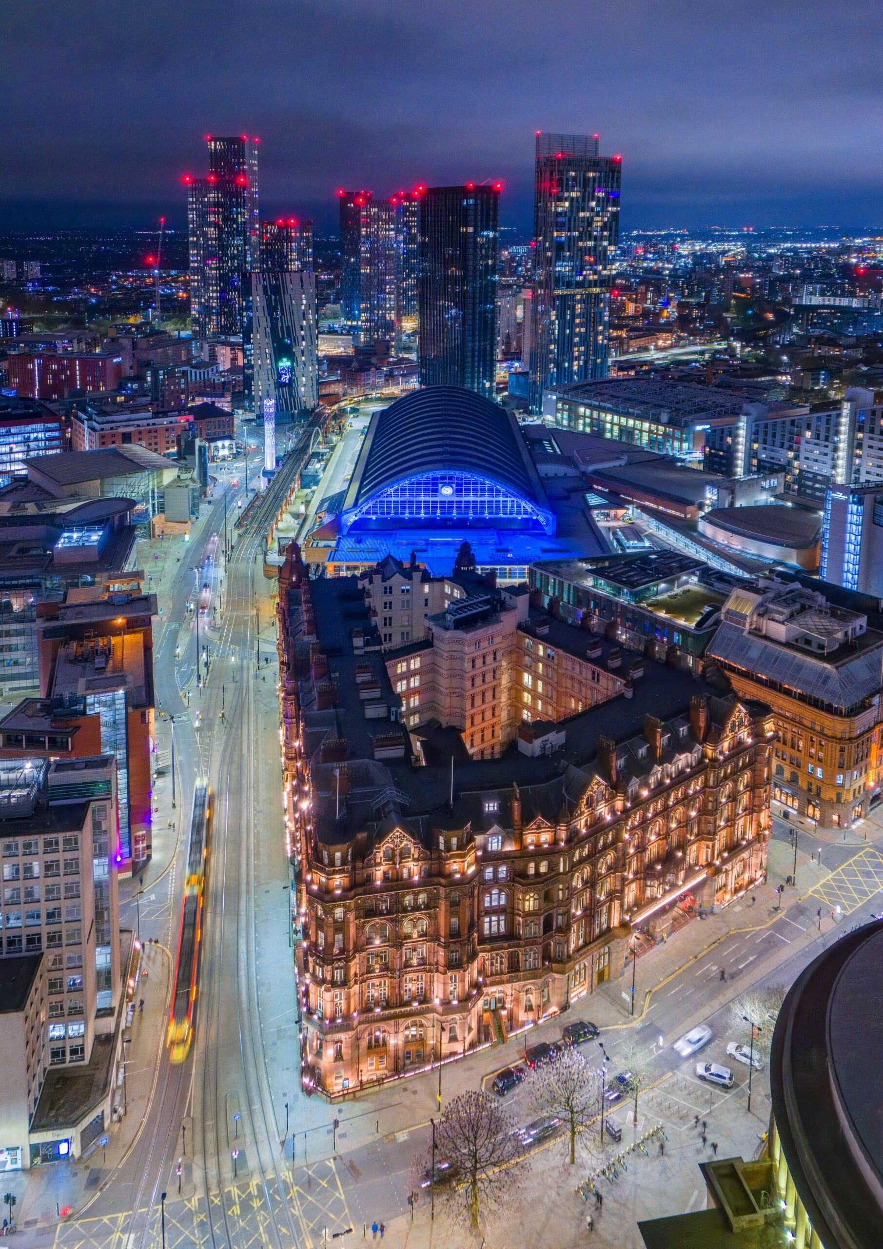 Aerial view of Manchester city centre at night, looking from St Peter's Square out toward Deansgate