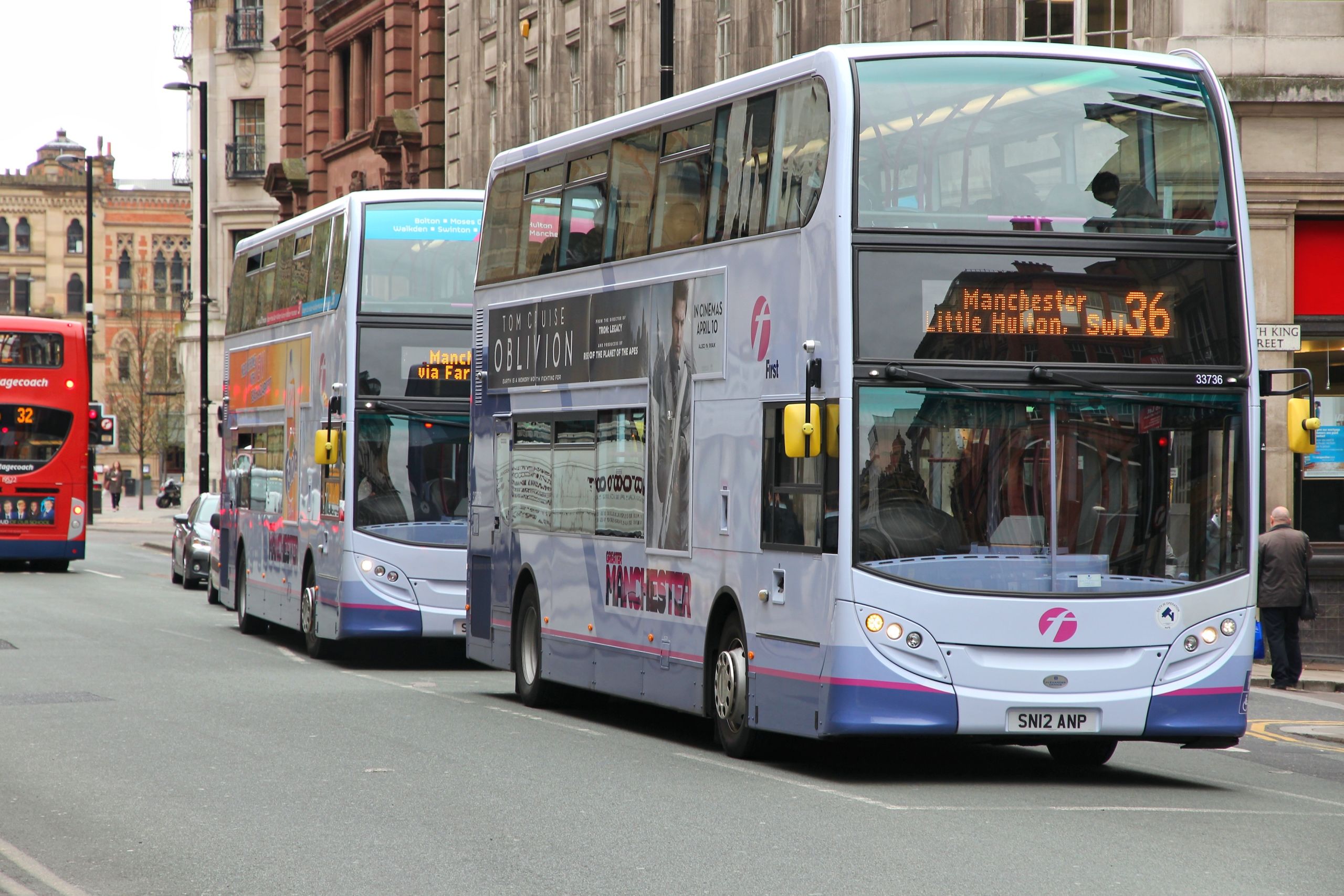 Two buses in Manchester city centre.