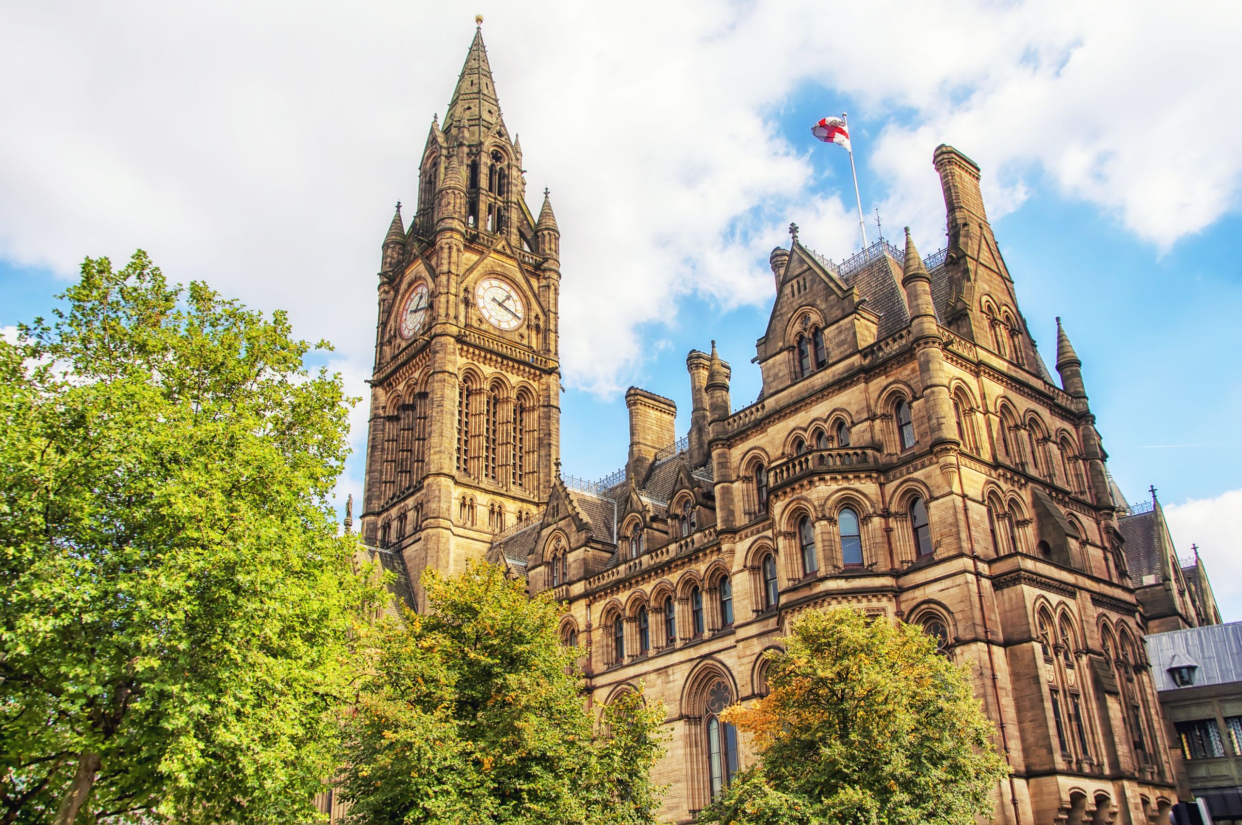 Manchester Town Hall on a sunny day. Photo taken of the clock from ground level