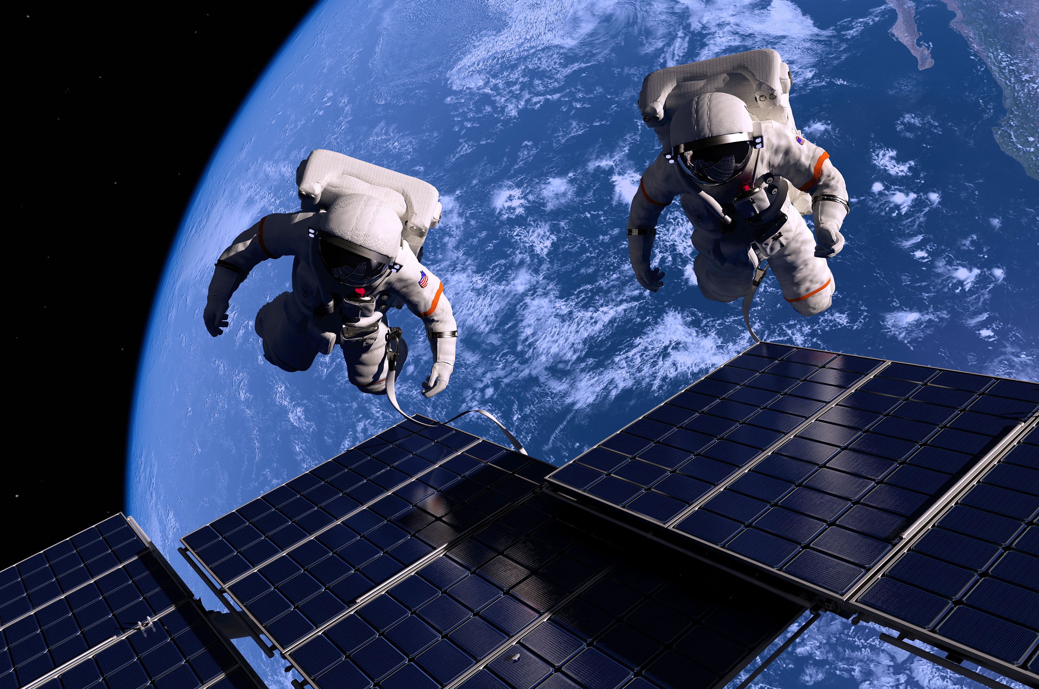 Astronauts in space around the solar battery