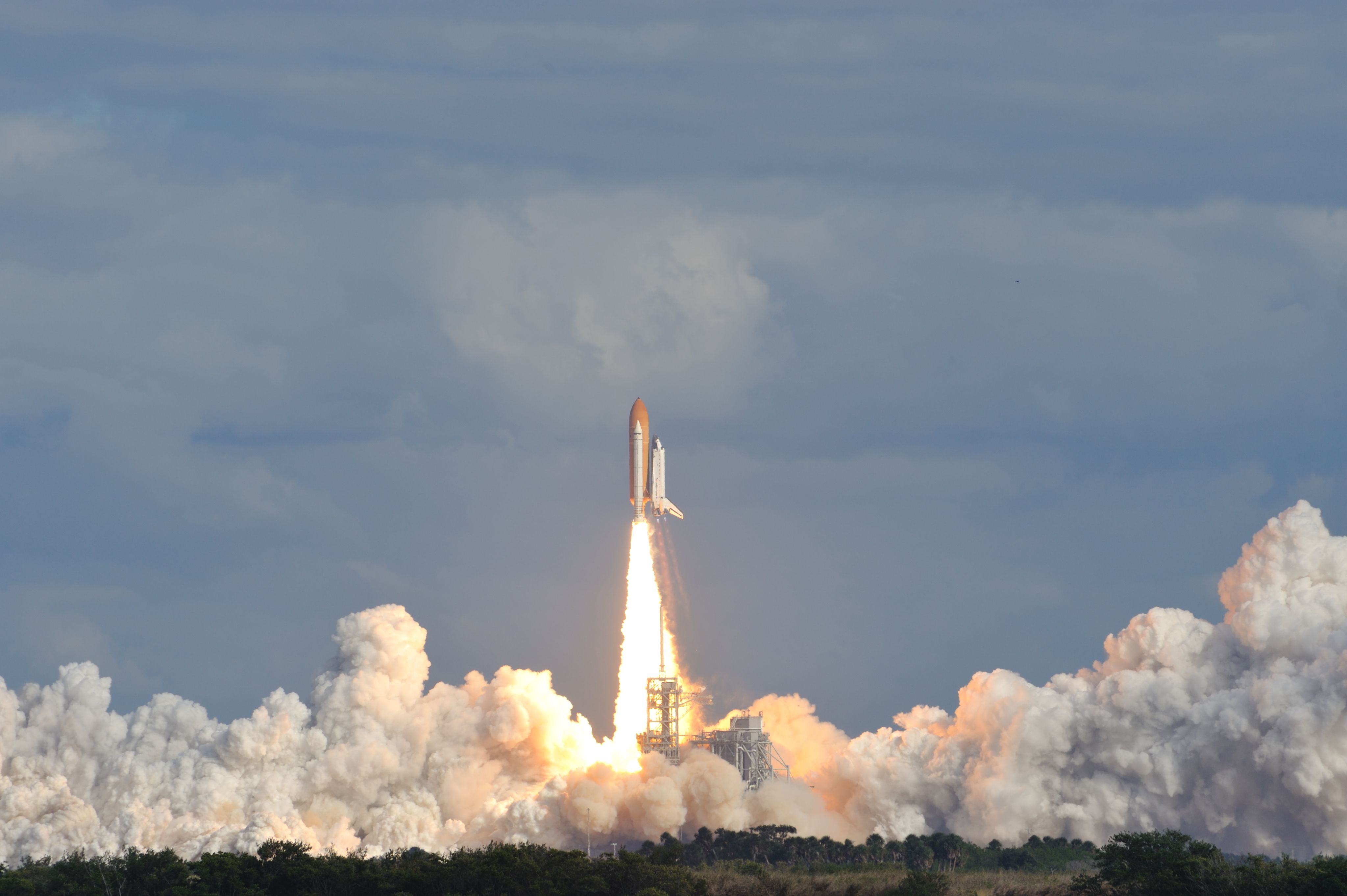 Image of Space Shuttle Atlantis launching from the Kennedy Space Center