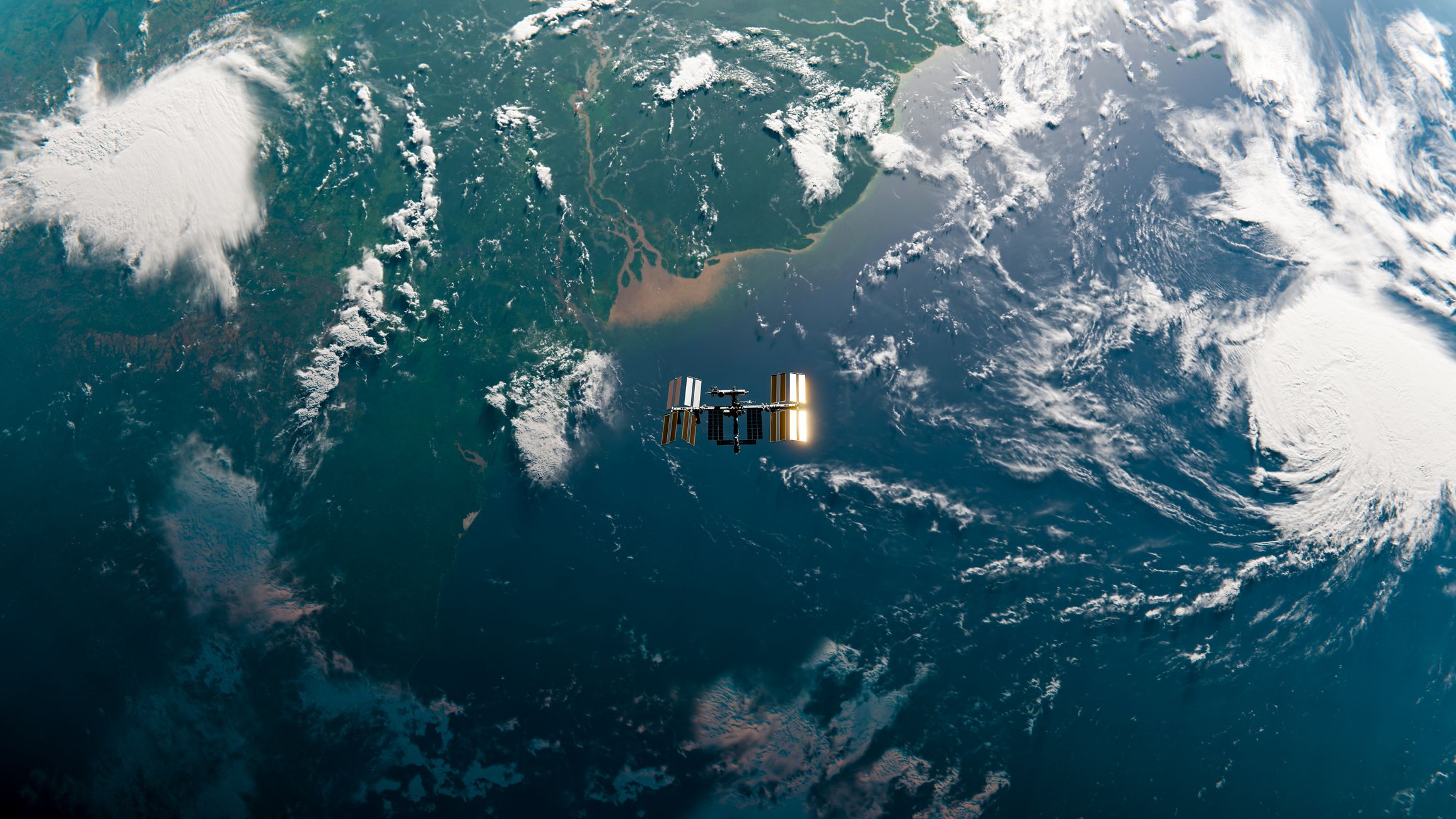Image of the International Spade Station orbiting over the end of the amazon river
