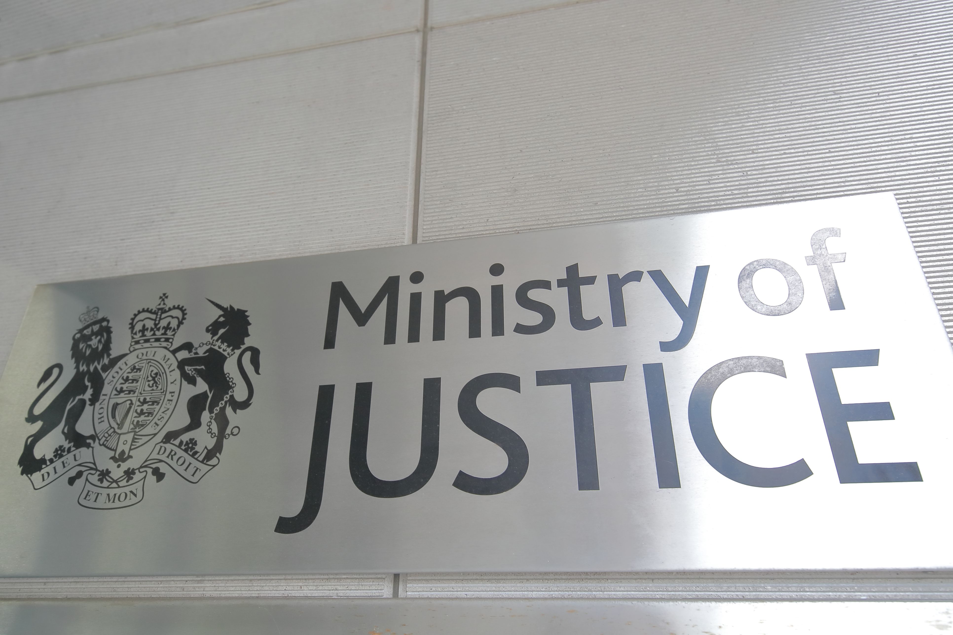 A photo of a sign for the Ministry of Justice