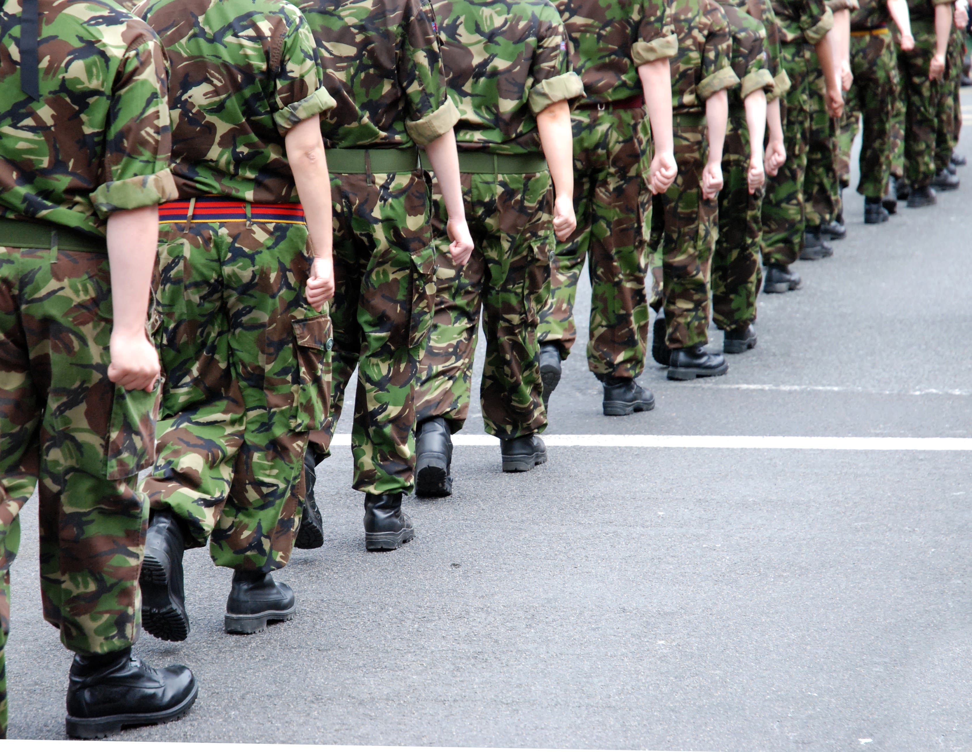 Soldiers in camouflage fatigues marching