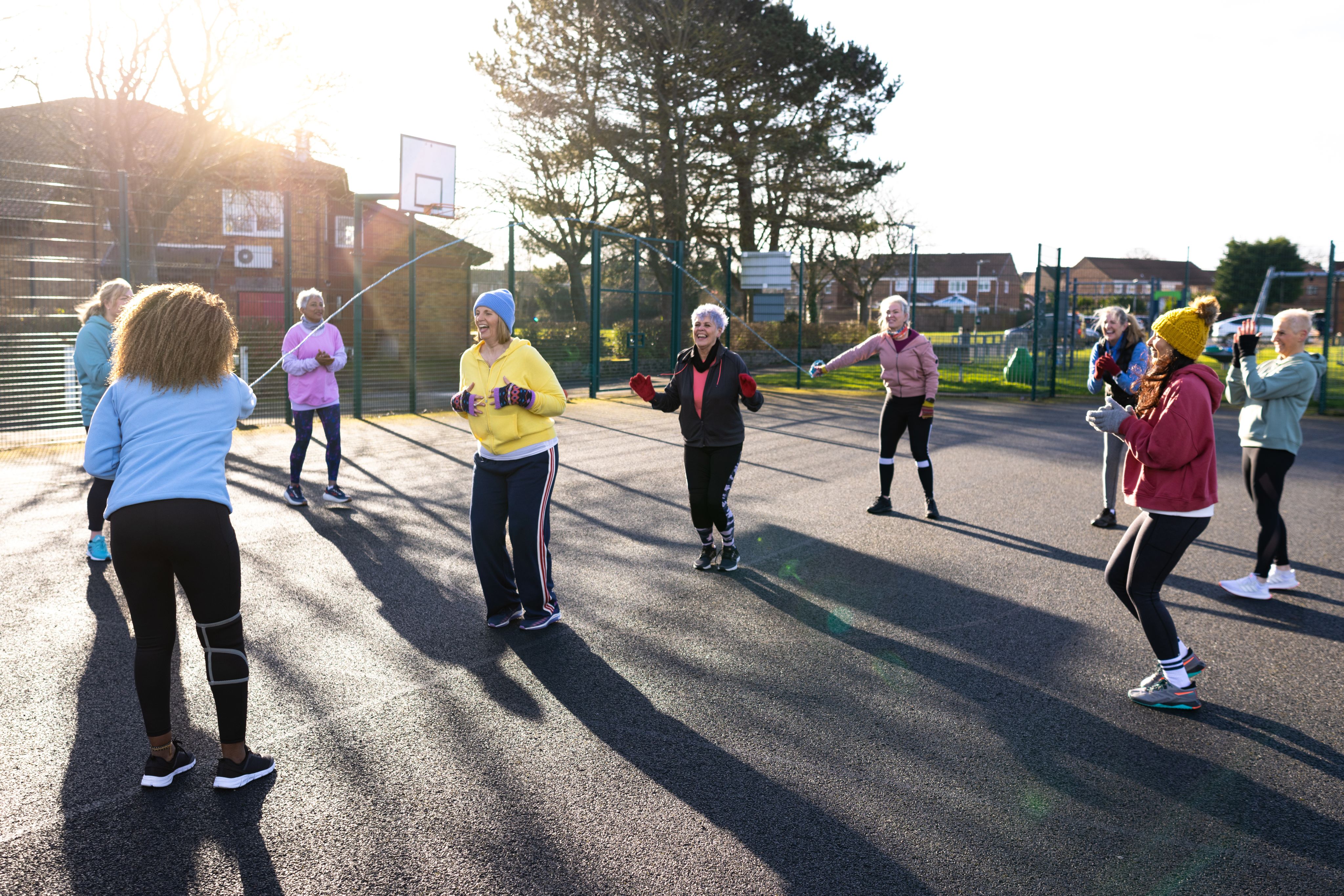 Middle aged ladies exercising in a park 